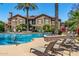 Resort-style pool with sun loungers and lush landscaping at this beautiful villa complex at 14250 W Wigwam Blvd # 2111, Litchfield Park, AZ 85340