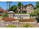 Stone sign amidst colorful flowers marking the entrance to Renaissance Villas at 14250 W Wigwam Blvd # 2111, Litchfield Park, AZ 85340