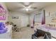 Cozy bedroom with soft carpet, ceiling fan, closet and window providing peaceful atmosphere at 14554 W Evans Dr, Surprise, AZ 85379
