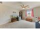 Spacious bonus room with ample natural light, carpeted flooring, and neutral wall color at 14554 W Evans Dr, Surprise, AZ 85379