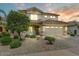 Charming two-story home boasts a well-maintained landscaped front yard and inviting curb appeal at 14554 W Evans Dr, Surprise, AZ 85379
