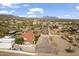 Comprehensive aerial shot of a Southwestern-style house featuring a horse arena and stunning mountain views at 1500 N Crismon Rd, Mesa, AZ 85207