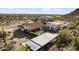 Bird's-eye view of a desert estate with a pool, horse facilities, and nearby mountain views at 1500 N Crismon Rd, Mesa, AZ 85207