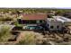 Aerial view of the backyard featuring a sparkling pool, mature landscaping, and outdoor living spaces at 1500 N Crismon Rd, Mesa, AZ 85207