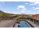 Breathtaking aerial view showcasing a pool, barn, and lush landscaping, set against a stunning mountain backdrop at 1500 N Crismon Rd, Mesa, AZ 85207