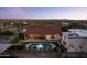 Resort-style backyard featuring a sparkling pool, manicured landscaping, and outdoor dining at 1500 N Crismon Rd, Mesa, AZ 85207