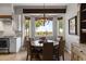 A large, round dining table with seating for six provides beautiful desert views at 1500 N Crismon Rd, Mesa, AZ 85207