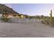 Elegant exterior of a spacious home with an enclosed horse area at 1500 N Crismon Rd, Mesa, AZ 85207