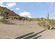 Expansive property with horse ring, desert landscaping, and mountain views at 1500 N Crismon Rd, Mesa, AZ 85207