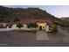 Charming single-story home with desert landscaping and well-lit front entry at 1500 N Crismon Rd, Mesa, AZ 85207