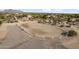 Outdoor horse ring with well-maintained perimeter fencing, in a desert community at 1500 N Crismon Rd, Mesa, AZ 85207