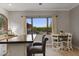 Eat-in kitchen area with large window and table that offers beautiful outdoor views at 1500 N Crismon Rd, Mesa, AZ 85207