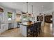 Modern kitchen featuring a large center island, stainless steel appliances, and bright natural light at 1500 N Crismon Rd, Mesa, AZ 85207