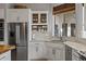 A close up of a modern kitchen features stainless steel appliances and marble countertops at 1500 N Crismon Rd, Mesa, AZ 85207