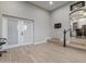 Spacious area with tile floors, glass doors to the outside, and steps to the kitchen at 1500 N Crismon Rd, Mesa, AZ 85207