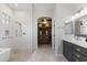 This bathroom is nicely decorated with a glass shower, vanity, and a walk-in closet at 1500 N Crismon Rd, Mesa, AZ 85207