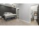 Bedroom with dark accent wall and ensuite bathroom at 1500 N Crismon Rd, Mesa, AZ 85207