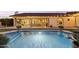 Sparkling pool with elegant outdoor lighting and covered patio area at 1500 N Crismon Rd, Mesa, AZ 85207