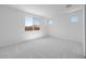 Spacious bedroom with carpet, large windows and bright lighting at 18141 W Hiddenview Dr, Goodyear, AZ 85338