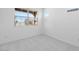 Bedroom with carpet, large windows and bright lighting at 18141 W Hiddenview Dr, Goodyear, AZ 85338