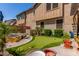 Lush backyard with putting green, spa, and manicured landscaping at 1931 E Lantana Dr, Chandler, AZ 85286