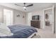 Bedroom with a cozy bed, wooden dresser, and ceiling fan at 1931 E Lantana Dr, Chandler, AZ 85286