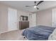 Bedroom featuring ceiling fan, wooden dresser, and natural light at 1931 E Lantana Dr, Chandler, AZ 85286