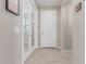 Light-filled foyer with tile flooring and a pristine white front door at 1931 E Lantana Dr, Chandler, AZ 85286