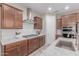 A kitchen featuring granite countertops, stainless steel appliances, dark wood cabinets and a gas range at 1931 E Lantana Dr, Chandler, AZ 85286