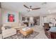 Open-concept living room with kitchen and a neutral color palette at 1931 E Lantana Dr, Chandler, AZ 85286