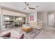 Bright living space with a ceiling fan and large sliding glass doors at 1931 E Lantana Dr, Chandler, AZ 85286