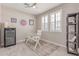 This is a charming office space with unique decor, tiled floors, white trim, and natural light at 1931 E Lantana Dr, Chandler, AZ 85286