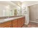 Bathroom featuring dual sinks, granite countertops, and walk-in shower at 19700 N 76Th St # 2101, Scottsdale, AZ 85255