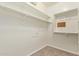 Walk-in closet with shelves and carpet at 19700 N 76Th St # 2101, Scottsdale, AZ 85255