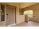 The covered entryway with a decorative front door with a lock and a window at 19700 N 76Th St # 2101, Scottsdale, AZ 85255