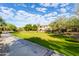 Well maintained building exterior overlooking a large manicured green space and walking path at 19700 N 76Th St # 2101, Scottsdale, AZ 85255