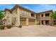The exterior view of a home with a private two-car garage, balcony, and desert landscaping at 19700 N 76Th St # 2101, Scottsdale, AZ 85255