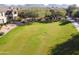 Large manicured community green space with lush lawn, trees, and mountain views at 19700 N 76Th St # 2101, Scottsdale, AZ 85255