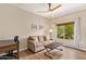 Living room with wood floors and a comfortable couch with decorative throw pillows at 19700 N 76Th St # 2101, Scottsdale, AZ 85255