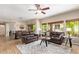 The living room features comfortable seating and views of the desert landscaping outside at 19700 N 76Th St # 2101, Scottsdale, AZ 85255