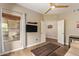 Living room with wood floors, a ceiling fan, and a large window with lots of light at 19700 N 76Th St # 2101, Scottsdale, AZ 85255