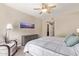 Bedroom boasts natural light, fan, and neutral color scheme at 19700 N 76Th St # 2101, Scottsdale, AZ 85255