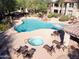 Gorgeous aerial view of community pool with spa and comfortable lounge seating at 19700 N 76Th St # 2101, Scottsdale, AZ 85255