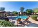 Inviting community pool with lounge chairs and shaded seating areas for residents at 19700 N 76Th St # 2101, Scottsdale, AZ 85255