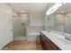 Bathroom with dual sinks, walk-in shower and a large mirror, and modern fixtures at 19700 N 76Th St # 2169, Scottsdale, AZ 85255