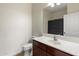 Clean and well-maintained bathroom featuring a vanity with updated faucet and toilet at 19700 N 76Th St # 2169, Scottsdale, AZ 85255