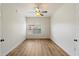 Well-lit bedroom offers vinyl flooring, a ceiling fan and a large window view at 19700 N 76Th St # 2169, Scottsdale, AZ 85255