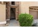 Inviting entryway with stone accents and a well-maintained bush near the unit's entrance at 19700 N 76Th St # 2169, Scottsdale, AZ 85255