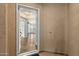 View of a bright foyer that leads to an open-plan living space and hardwood floors at 19700 N 76Th St # 2169, Scottsdale, AZ 85255