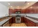 Stylish kitchen features stainless steel appliances, granite countertops, and ample cabinetry at 19700 N 76Th St # 2169, Scottsdale, AZ 85255